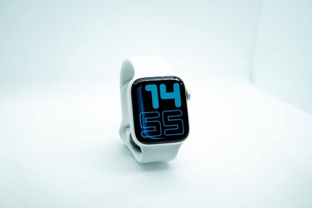 white and blue digital watch